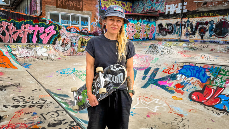 Skateboarding in Tampere, Finland: Heini Luotola with her board in the middle of the Kenneli DIY, every wall covered in graffiti. Photo by Mike Boisvert / The Skate Nomad