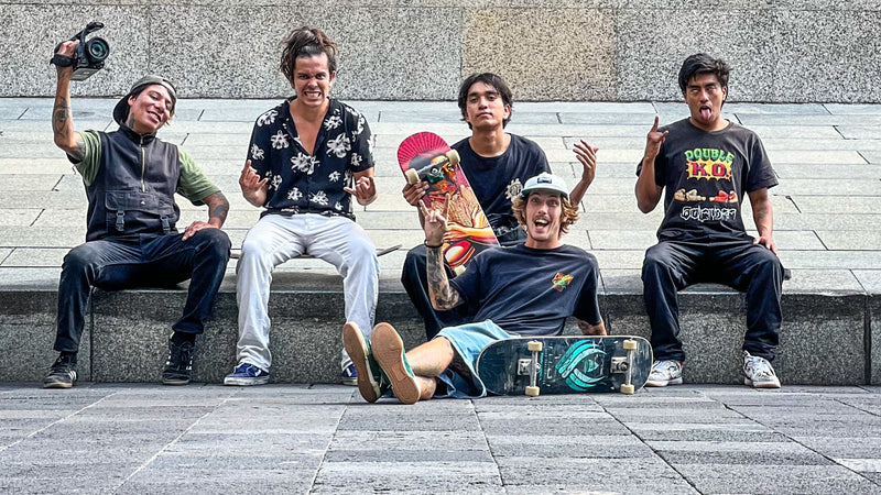 Skateboarding in Mexico City: a crew of skaters and filmers at the foot of a monument. Photo by Mike Boisvert / The Skate Nomad