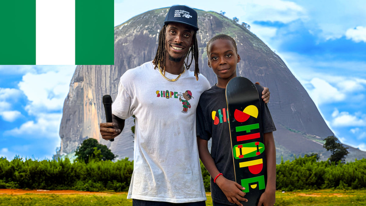 Skateboarding in Nigeria: Imoh Ekasi-Otu of Shape Skate Foundation with a young skater and his Shape board, the Nigerian flag in the corner. Photo by Mike Boisvert / The Skate Nomad