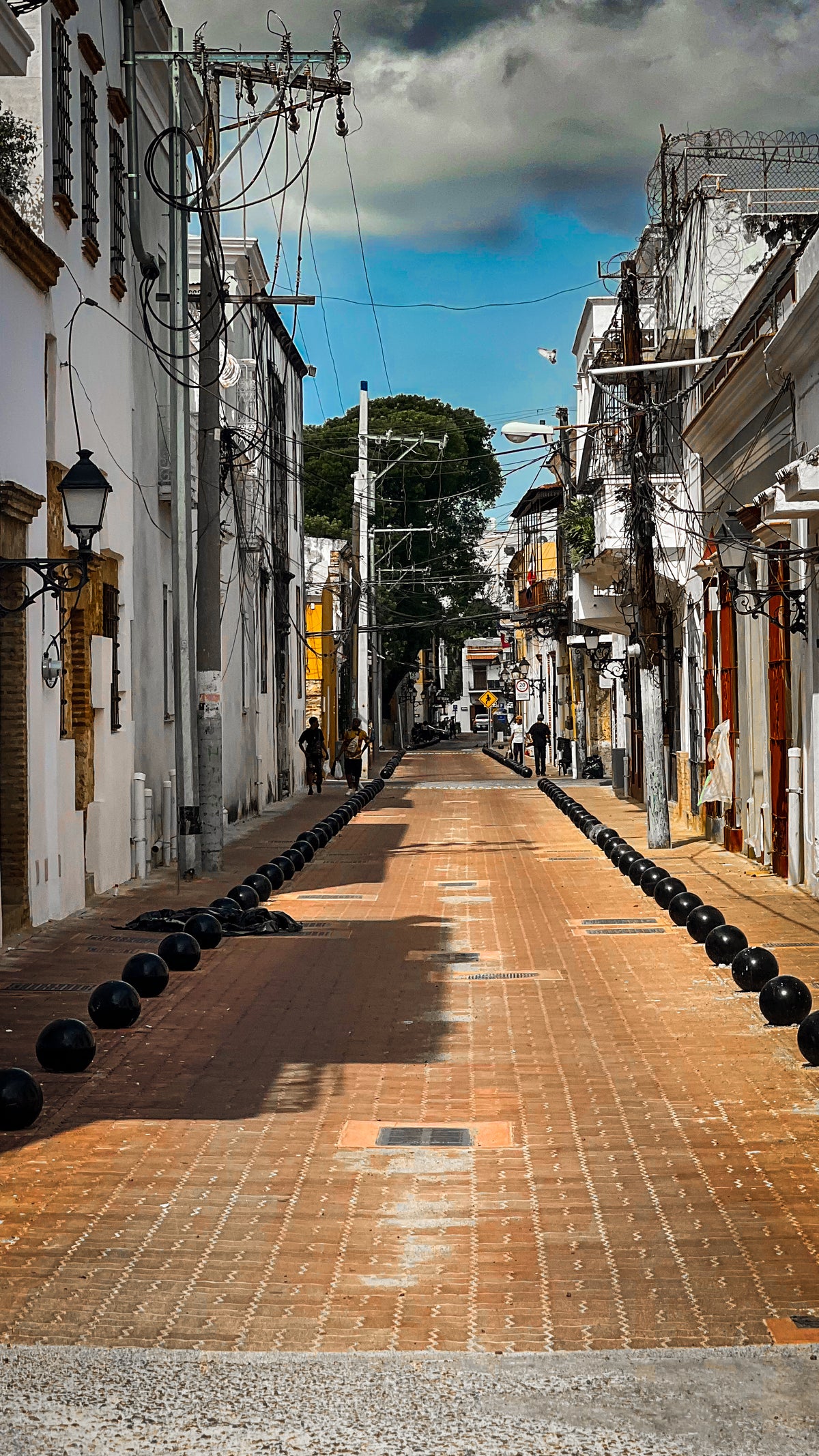 Dominican Republic: a brick-paved colonial street lined with old balconied buildings. Photo by Mike Boisvert / The Skate Nomad