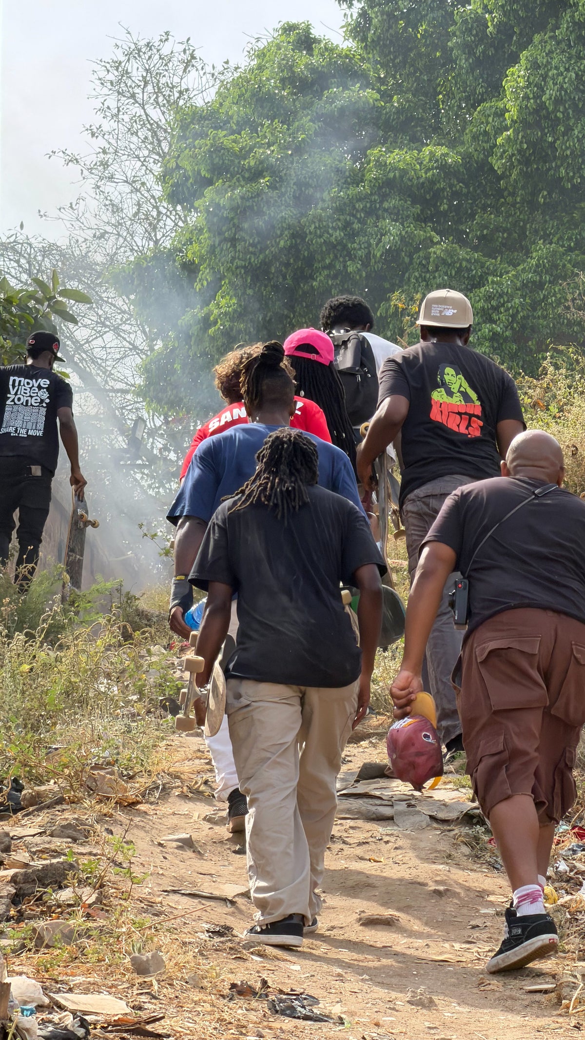Nigeria: the crew walks a dirt trail to the next spot. Photo by Mike Boisvert / The Skate Nomad