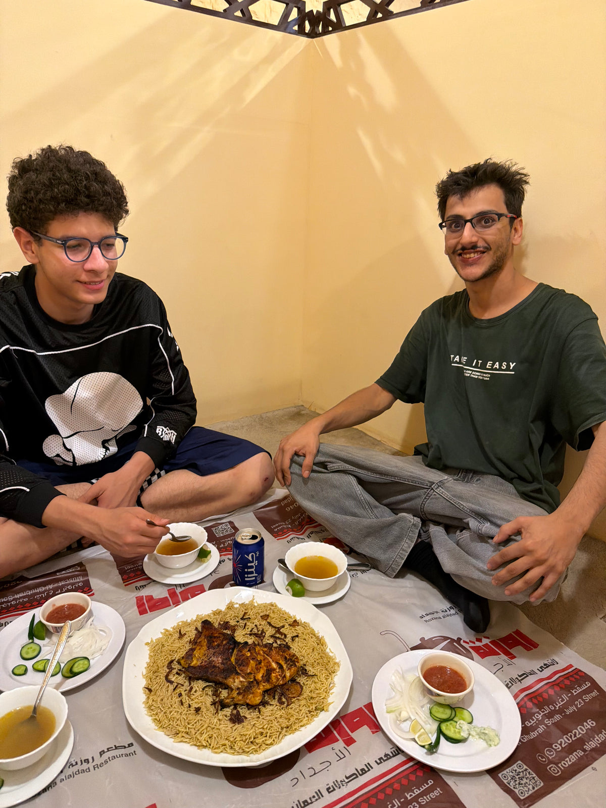 Oman: local skaters share a meal of rice and meat. Photo by Mike Boisvert / The Skate Nomad