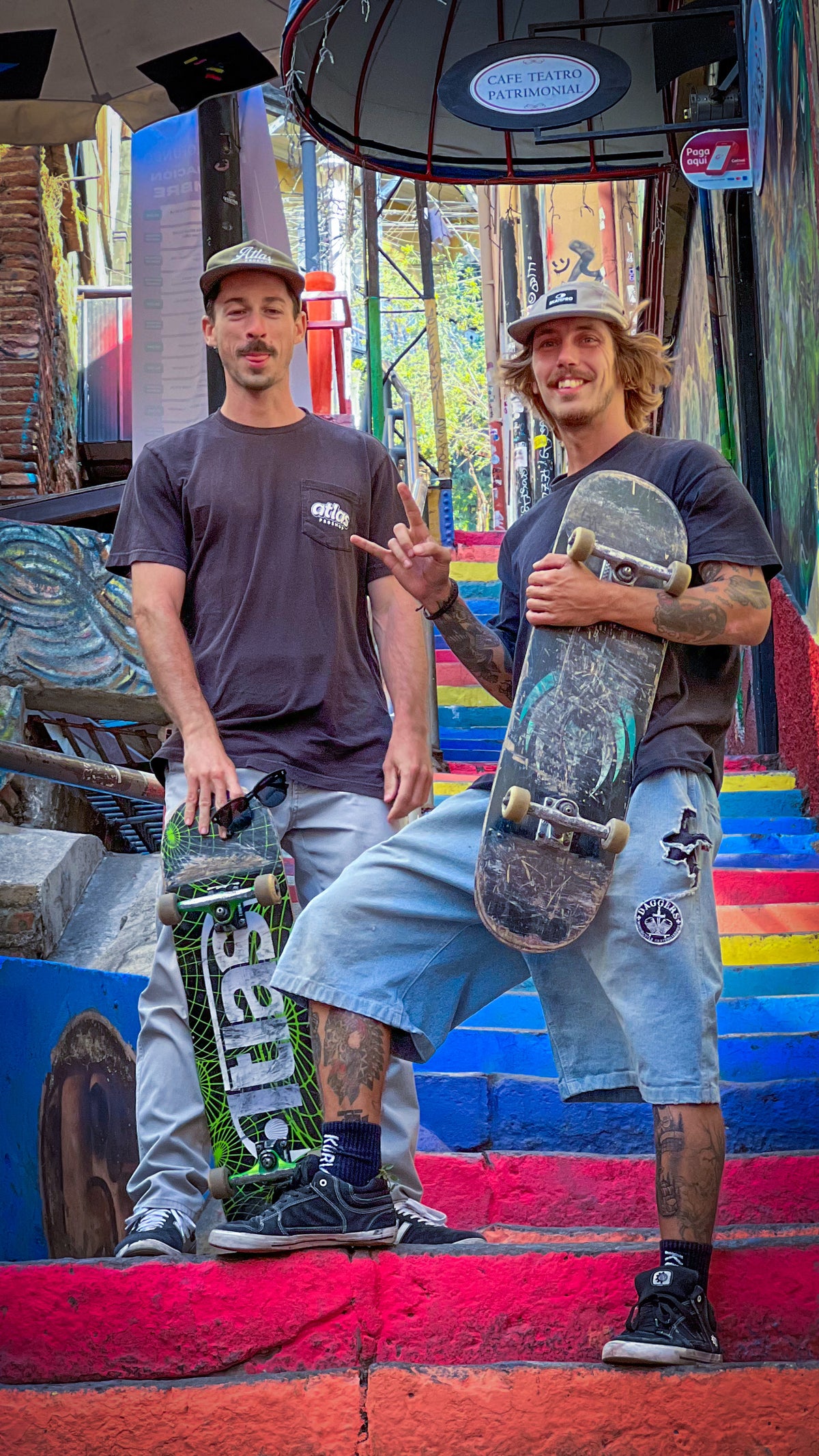 Valparaíso, Chile: Mike Boisvert and a friend with their boards on rainbow-painted stairs. Photo by Mike Boisvert / The Skate Nomad