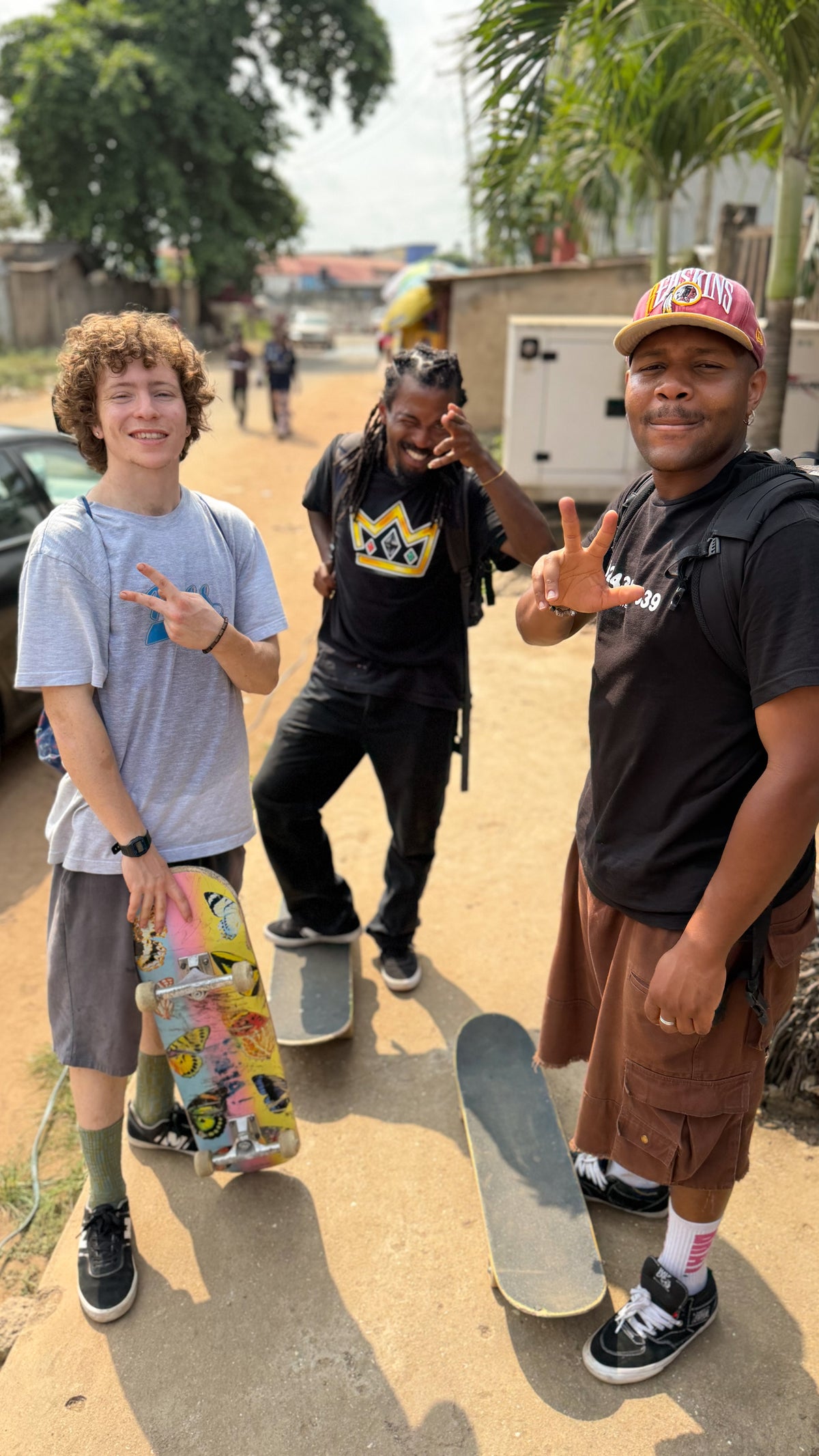 Nigeria: skaters on a dirt street between sessions. Photo by Mike Boisvert / The Skate Nomad