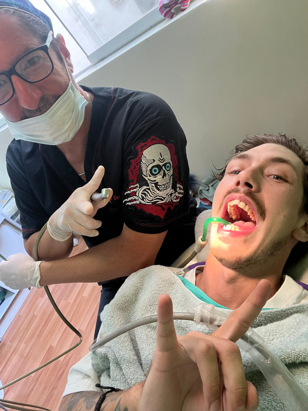 Peru: Mike Boisvert in the dentist's chair, the dentist in a coat with a Powell Peralta patch. Photo by Mike Boisvert / The Skate Nomad