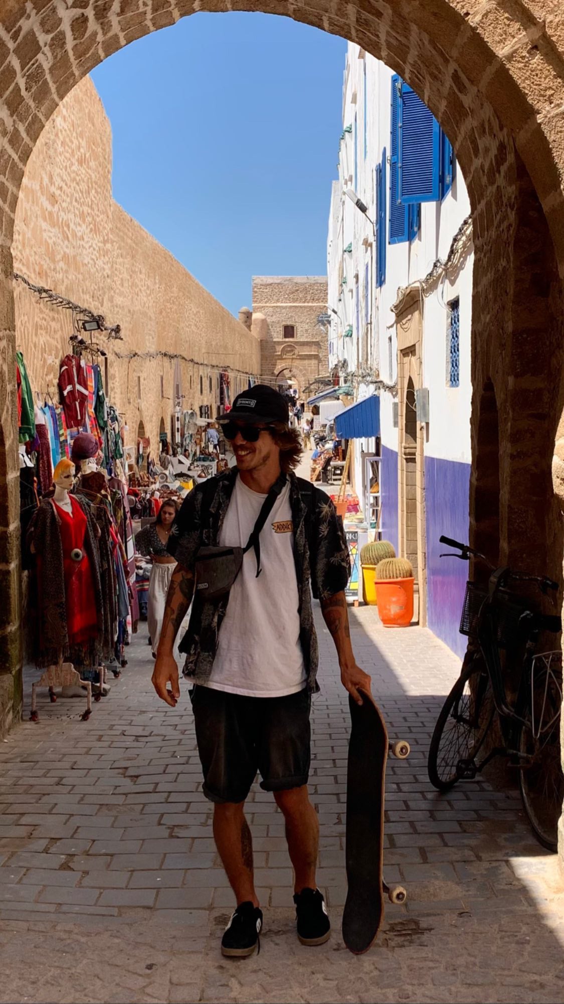 Morocco: Mike Boisvert walks through a medina gate with his board. Photo by Mike Boisvert / The Skate Nomad