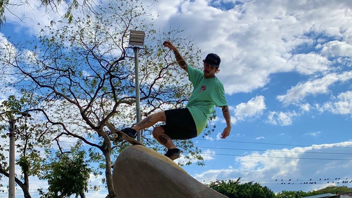 Skateboarding in El Salvador: a skater launches an air off a concrete hip at a San Salvador skatepark. Photo by Mike Boisvert / The Skate Nomad