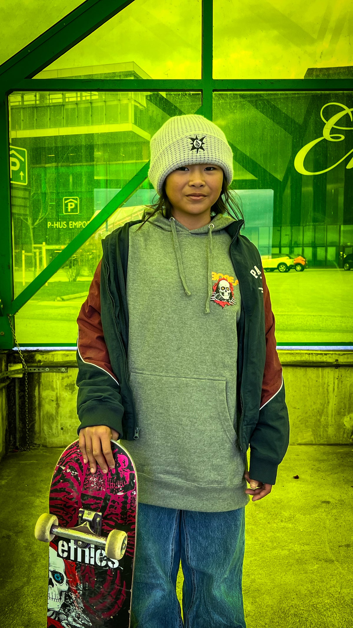Skateboarding in Malmö, Sweden: Mazel Paris with her board. Photo by Mike Boisvert / The Skate Nomad