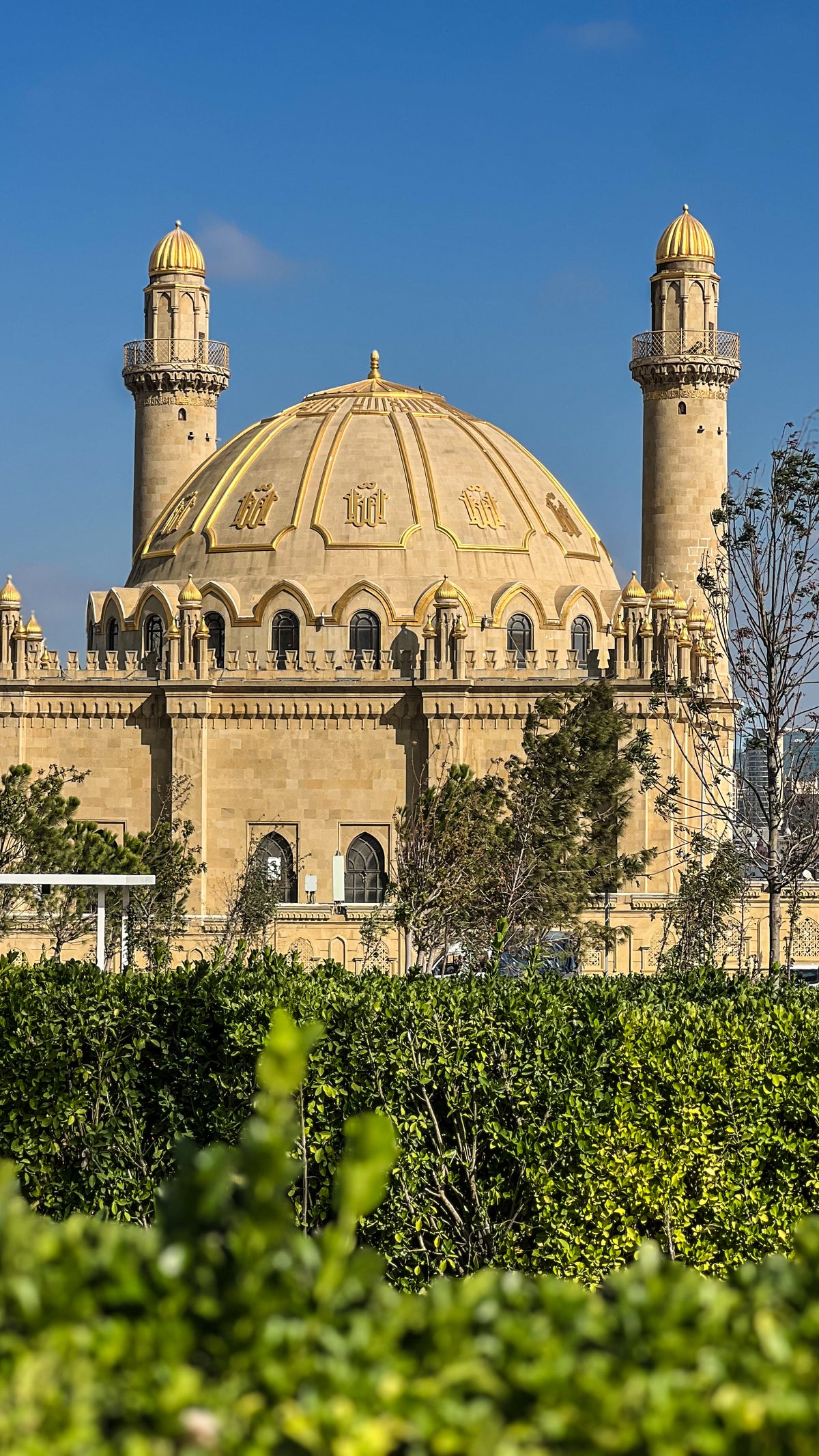 Baku, Azerbaijan: a domed mosque with two minarets under a clear blue sky. Photo by Mike Boisvert / The Skate Nomad